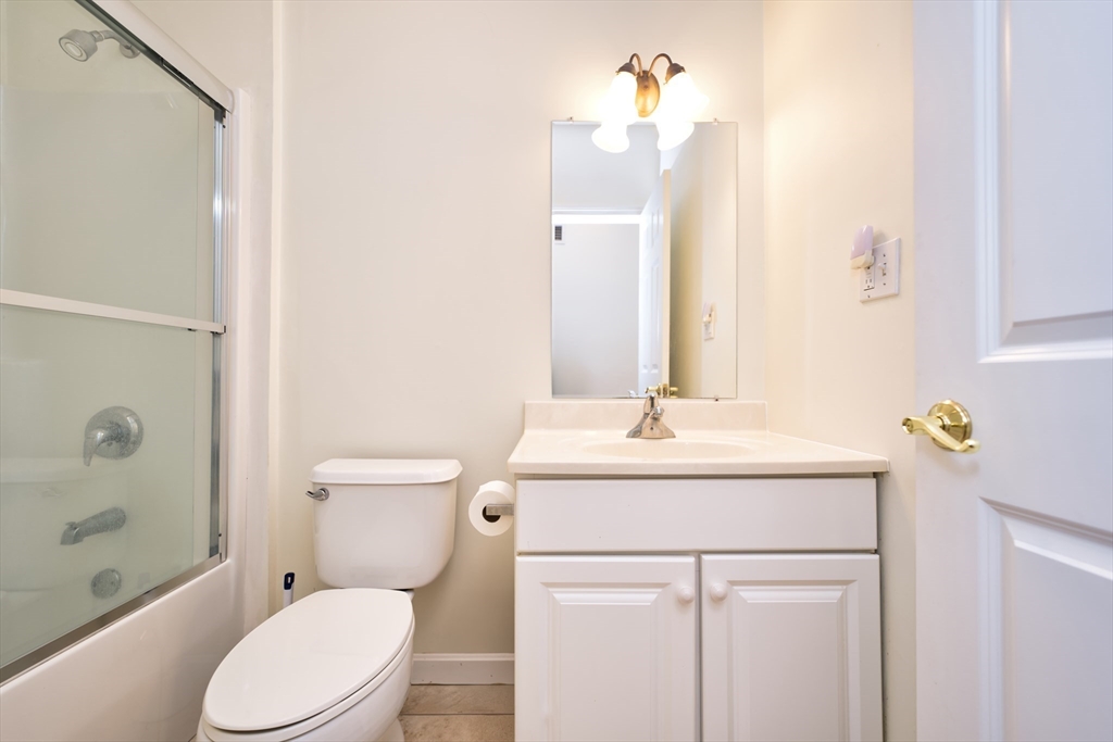 8 Village Way, Unit 8 Westport, MA 02790 - Photo 23 of 29 a bathroom with a sink a toilet and shower