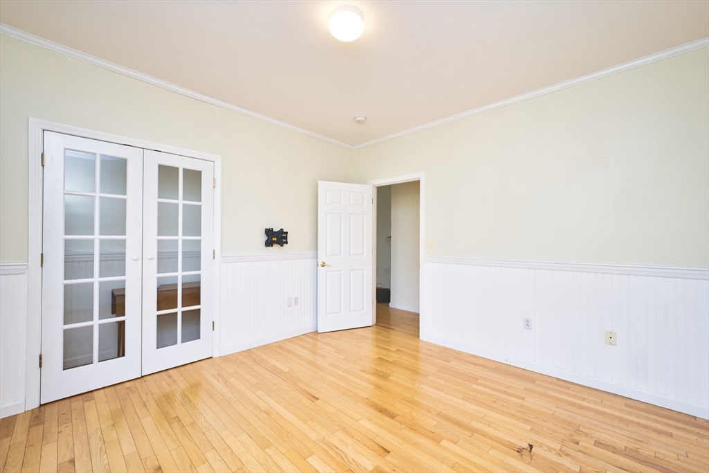 8 Village Way, Unit 8 Westport, MA 02790 - Photo 24 of 29 a view of empty room with wooden floor and windows