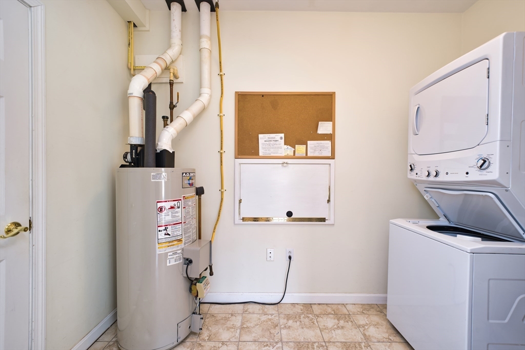 8 Village Way, Unit 8 Westport, MA 02790 - Photo 27 of 29 a room with storage and utility