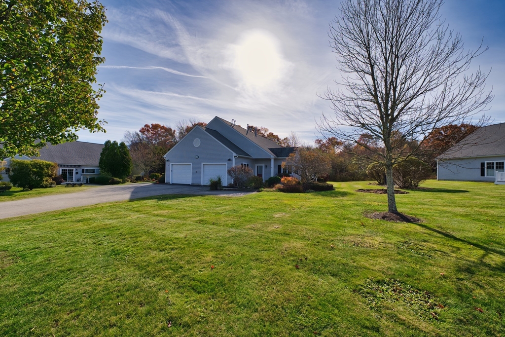 8 Village Way, Unit 8 Westport, MA 02790 - Photo 4 of 29 a house view with a sitting space and garden