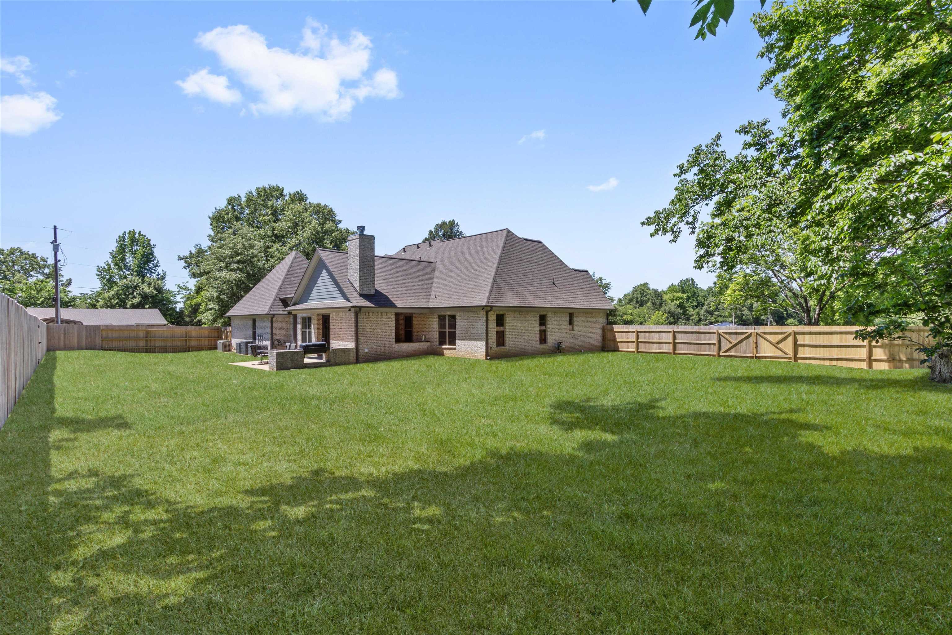 65 Watson Road Oakland, TN 38060 - Photo 35 of 40 a front view of a house with garden