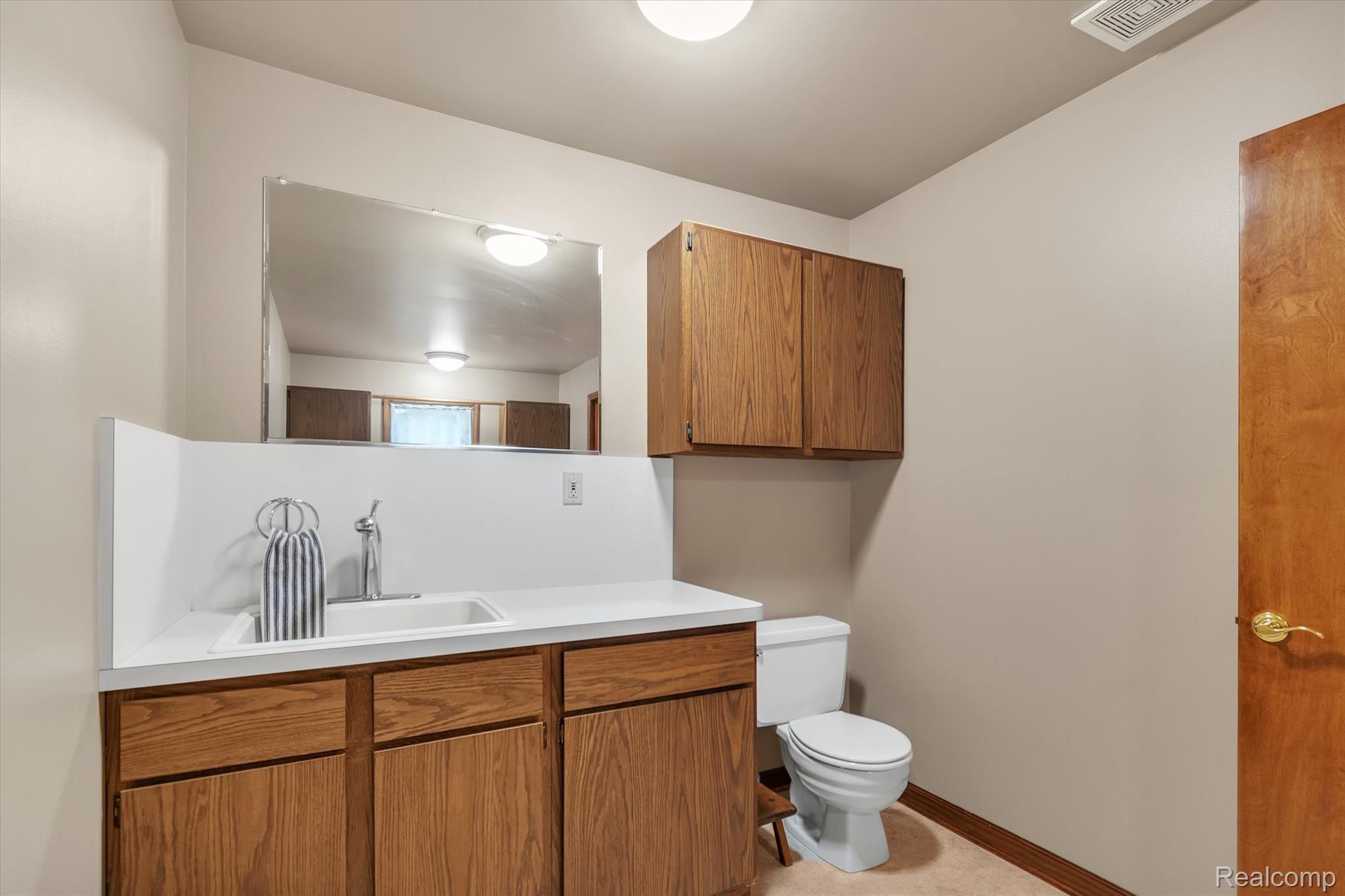 6451 Bullard Road Fenton, MI 48430 - Photo 16 of 29 Half bath included in laundry area