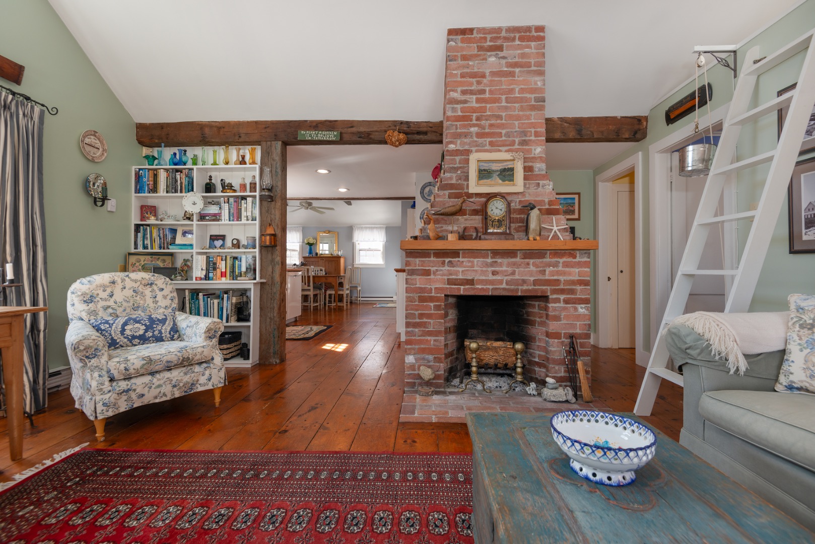 42 North Liberty Street Nantucket, MA 02554 - Photo 5 of 20 a living room with furniture and a fireplace