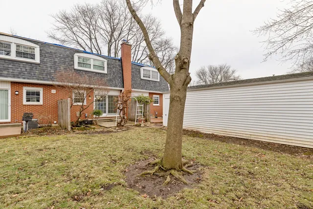a backyard of a house with seating space
