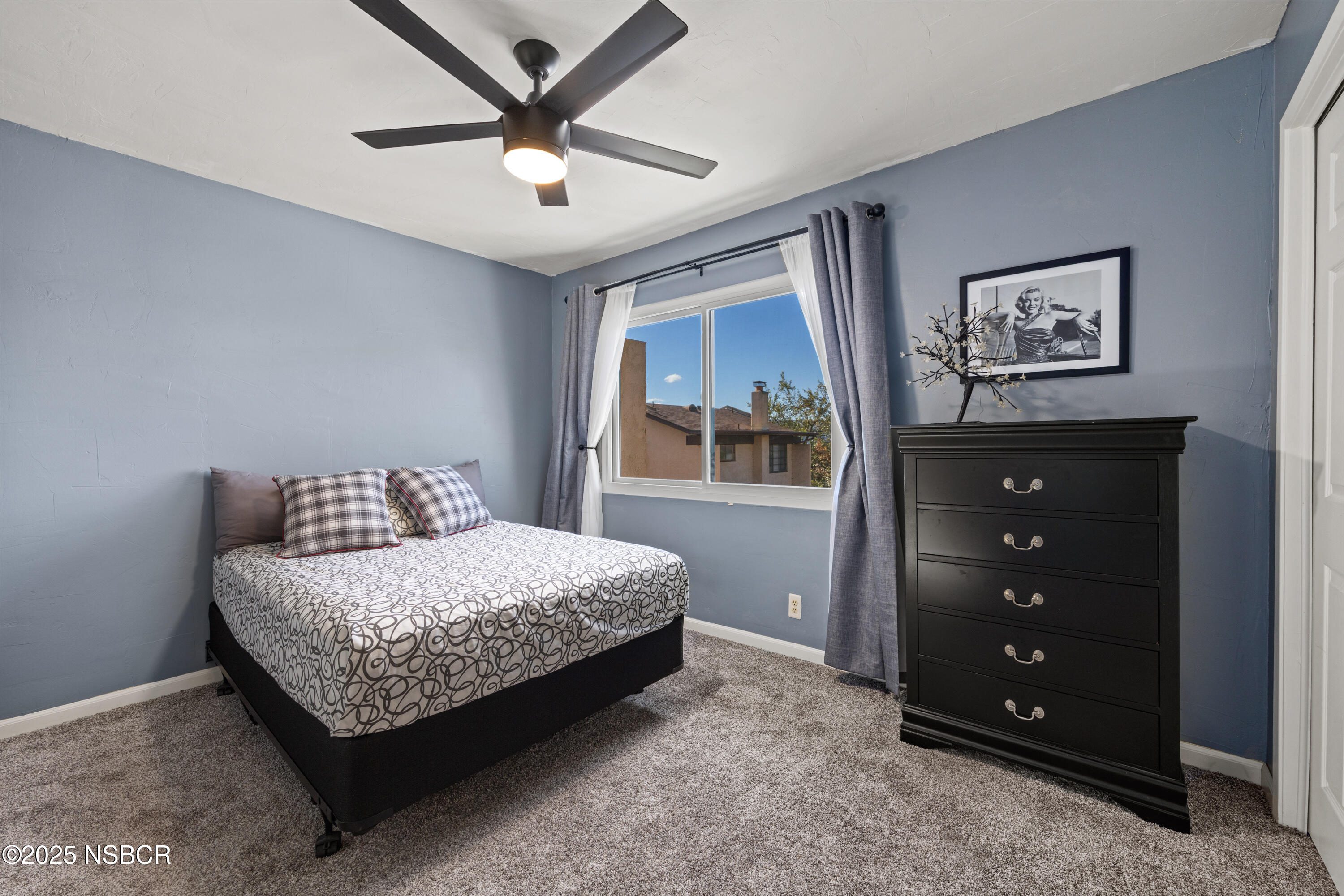 639 Roskilde Road Solvang, CA 93463 - Photo 19 of 27 a bedroom with a bed a window and a dresser