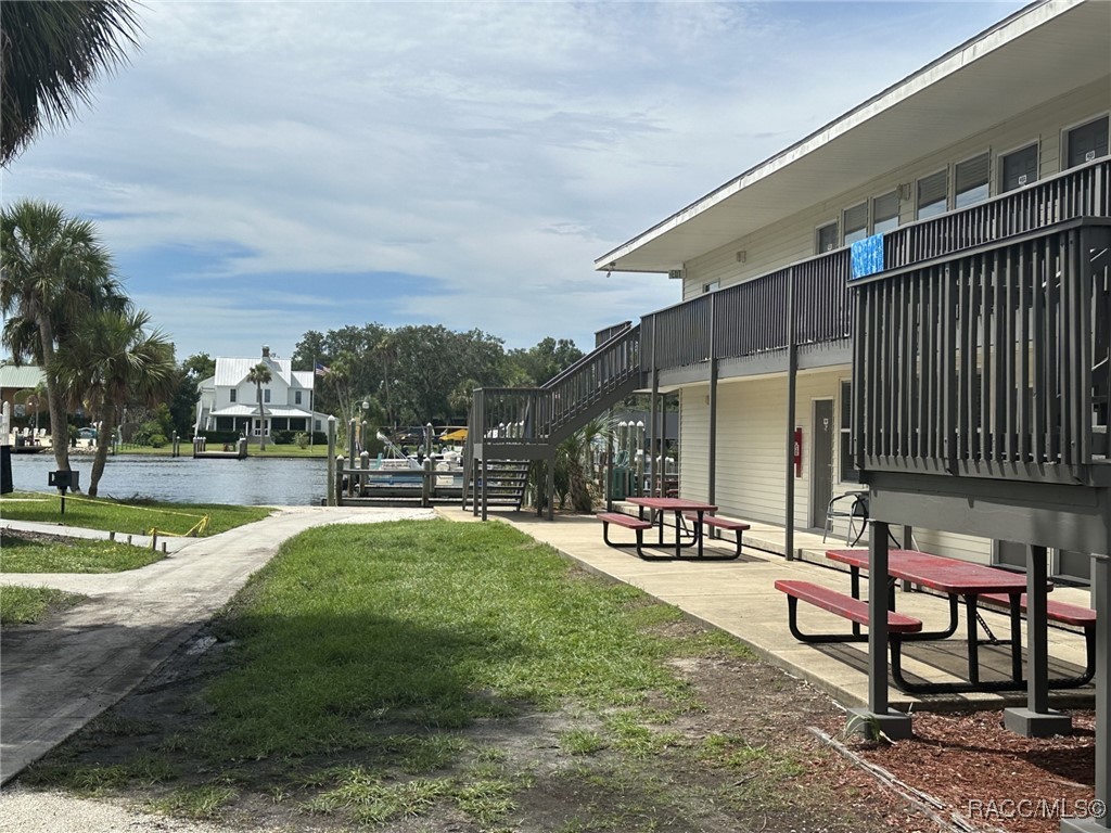 5291 South Cherokee Way Homosassa, FL 34448 - Photo 4 of 27 a swimming pool with outdoor seating and yard