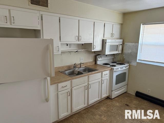418 South Graham Avenue Carbondale, IL 62901 - Photo 3 of 9 a kitchen with stainless steel appliances granite countertop a sink a stove and a refrigerator
