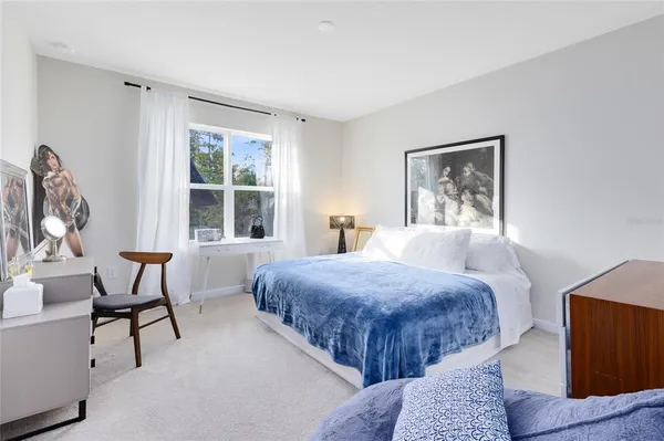 a bedroom with two beds and a window