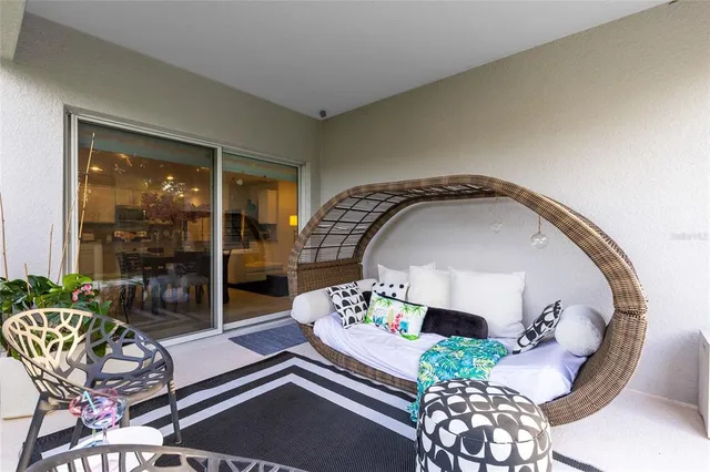 a living room with furniture and a mirror