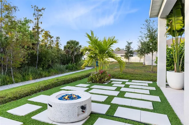 a view of a backyard with garden and plants