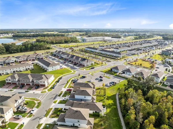 an aerial view of residential building and ocean view