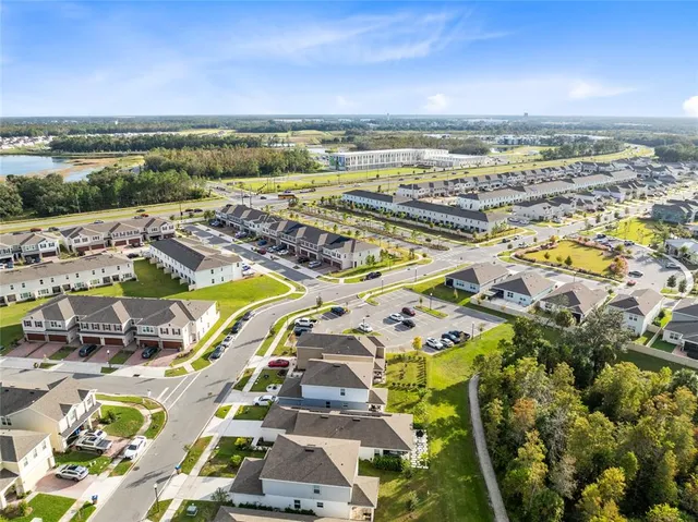 an aerial view of residential building and ocean view