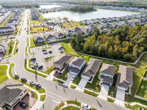 an aerial view of residential houses with outdoor space