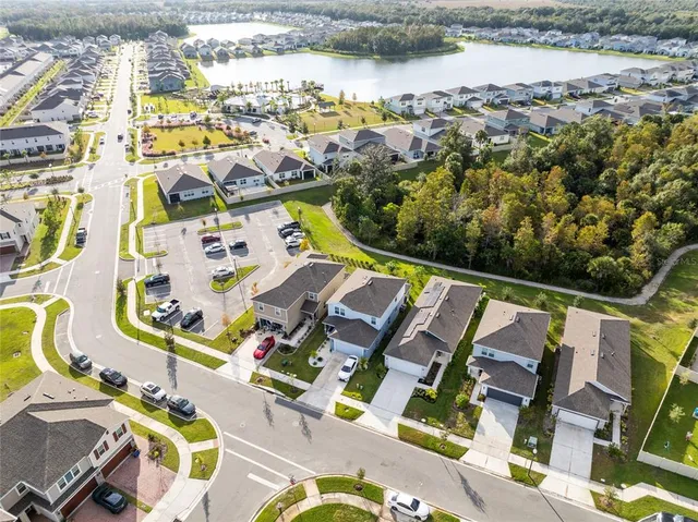 an aerial view of residential houses with outdoor space