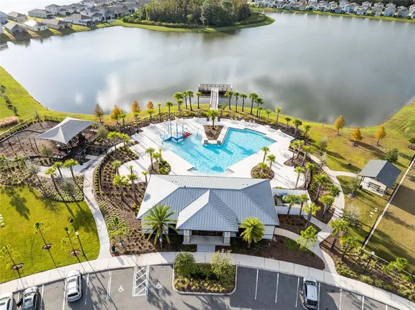 an aerial view of a house with a lake view