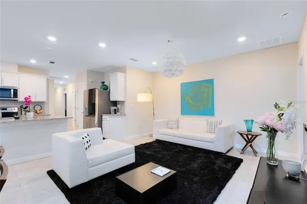 a living room with furniture and a rug