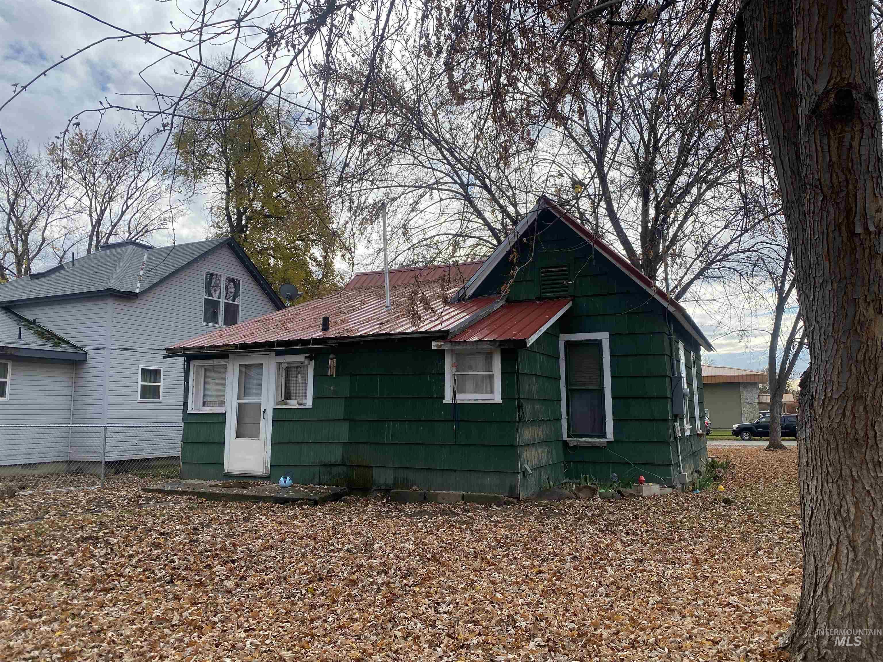 502 East Court Street Weiser, ID 83672 - Photo 14 of 17 Rear view of property featuring a metal roof