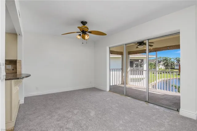 a view of a room with wooden floor and windows