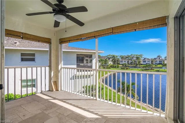 a view of a balcony with a floor to ceiling window and wooden floor