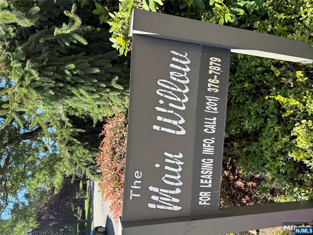 873 Main Street, Unit 2C Hackensack, NJ 07601 - Photo 2 of 11 a view of outdoor space with sign board