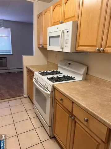 a kitchen with a stove and a microwave