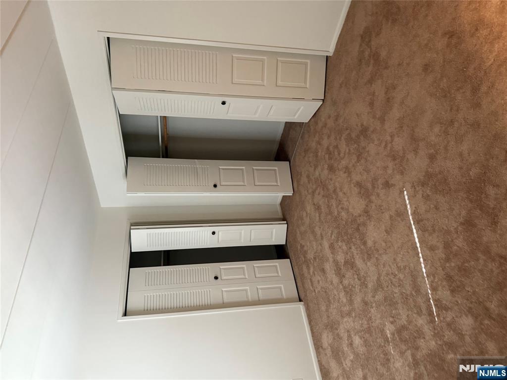 873 Main Street, Unit 2C Hackensack, NJ 07601 - Photo 10 of 11 a view of an empty room with closet area