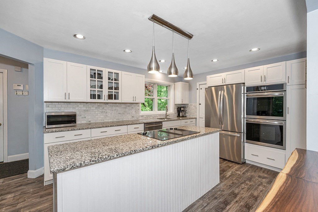 18 Fairview Farm Road Haverhill, MA 01832 - Photo 6 of 42 a kitchen with stainless steel appliances granite countertop a sink stove and refrigerator