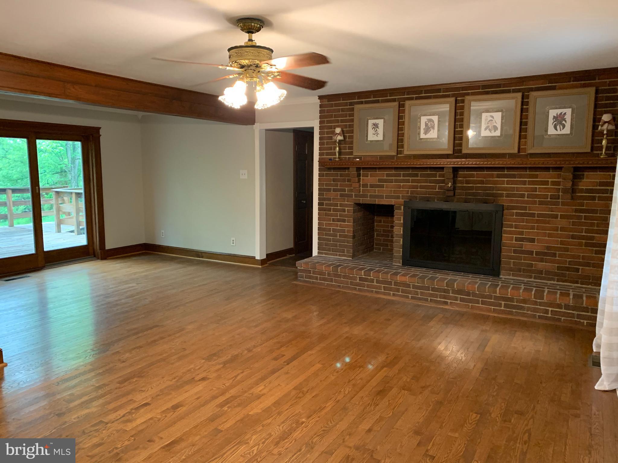 14138 Rover Mill Road West Friendship, MD 21794 - Photo 10 of 33 Living room with beautiful wood burning fireplace