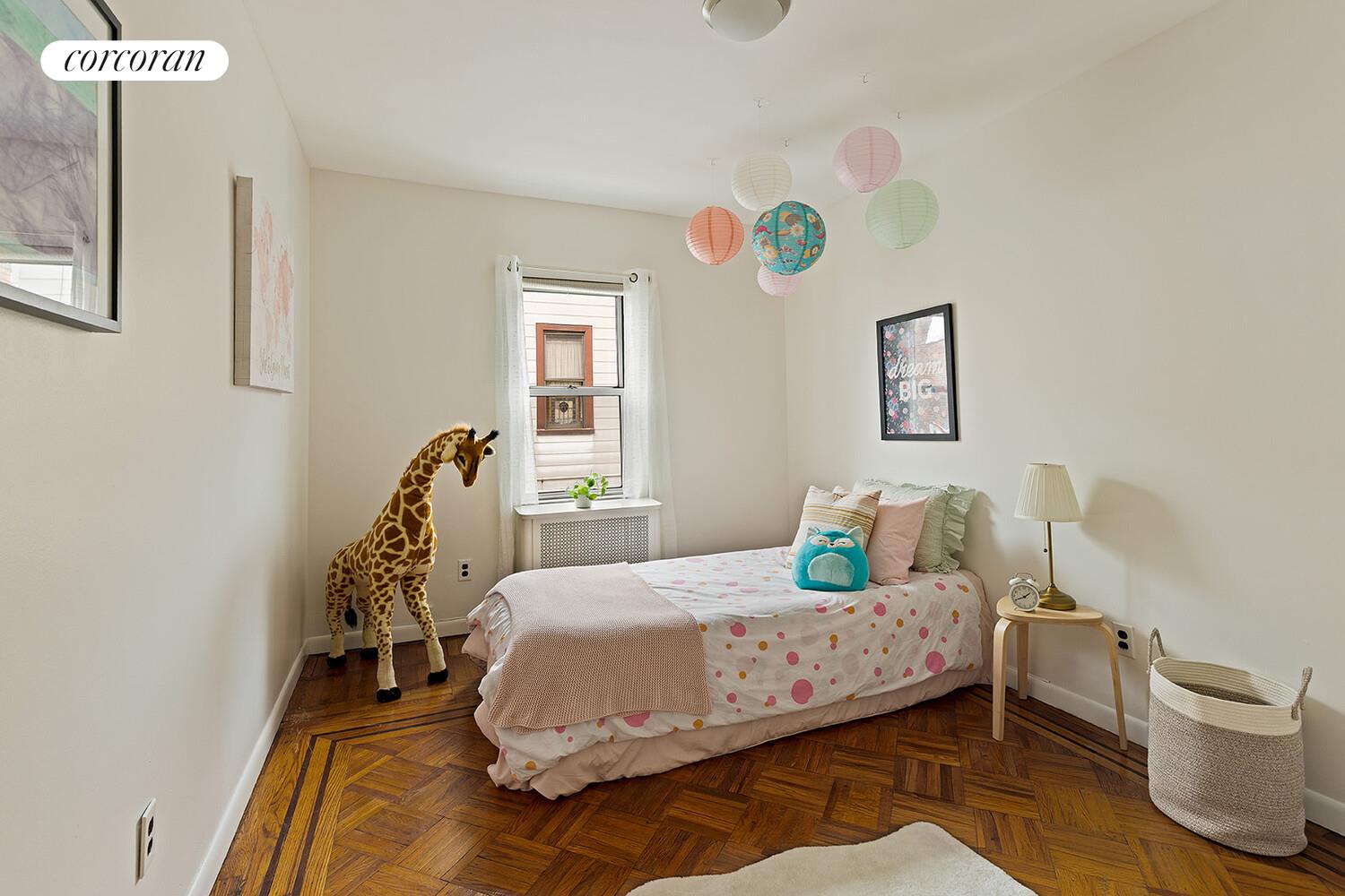 326 97th Street Brooklyn, NY 11209 - Photo 4 of 10 a bedroom with a bed and a window
