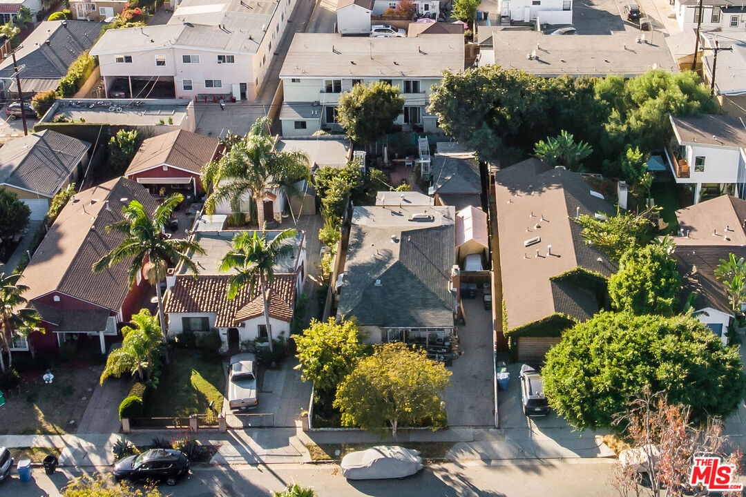 an aerial view of a houses with yard