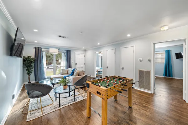 a kitchen with a granite countertop sink and a large window