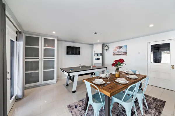a view of a dining room with furniture and a window
