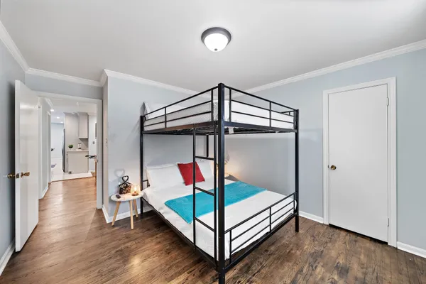 a bathroom with a sink a toilet and a window