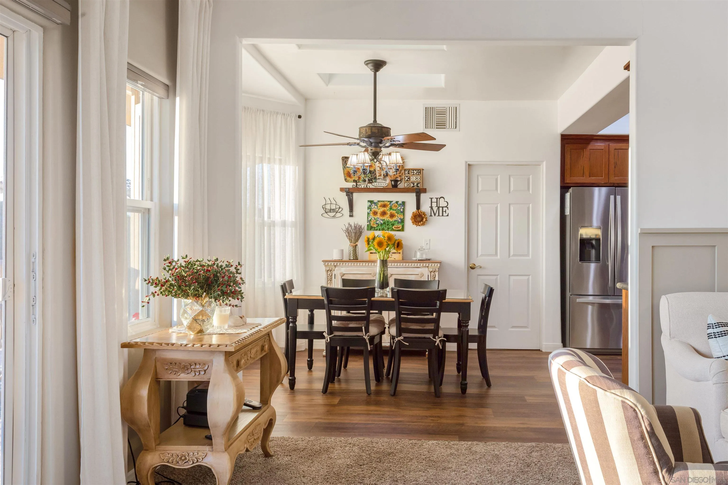 1210 Lakedale Road Santa Ysabel, CA 92070 - Photo 21 of 67 a view of a dining room with furniture and a chandelier