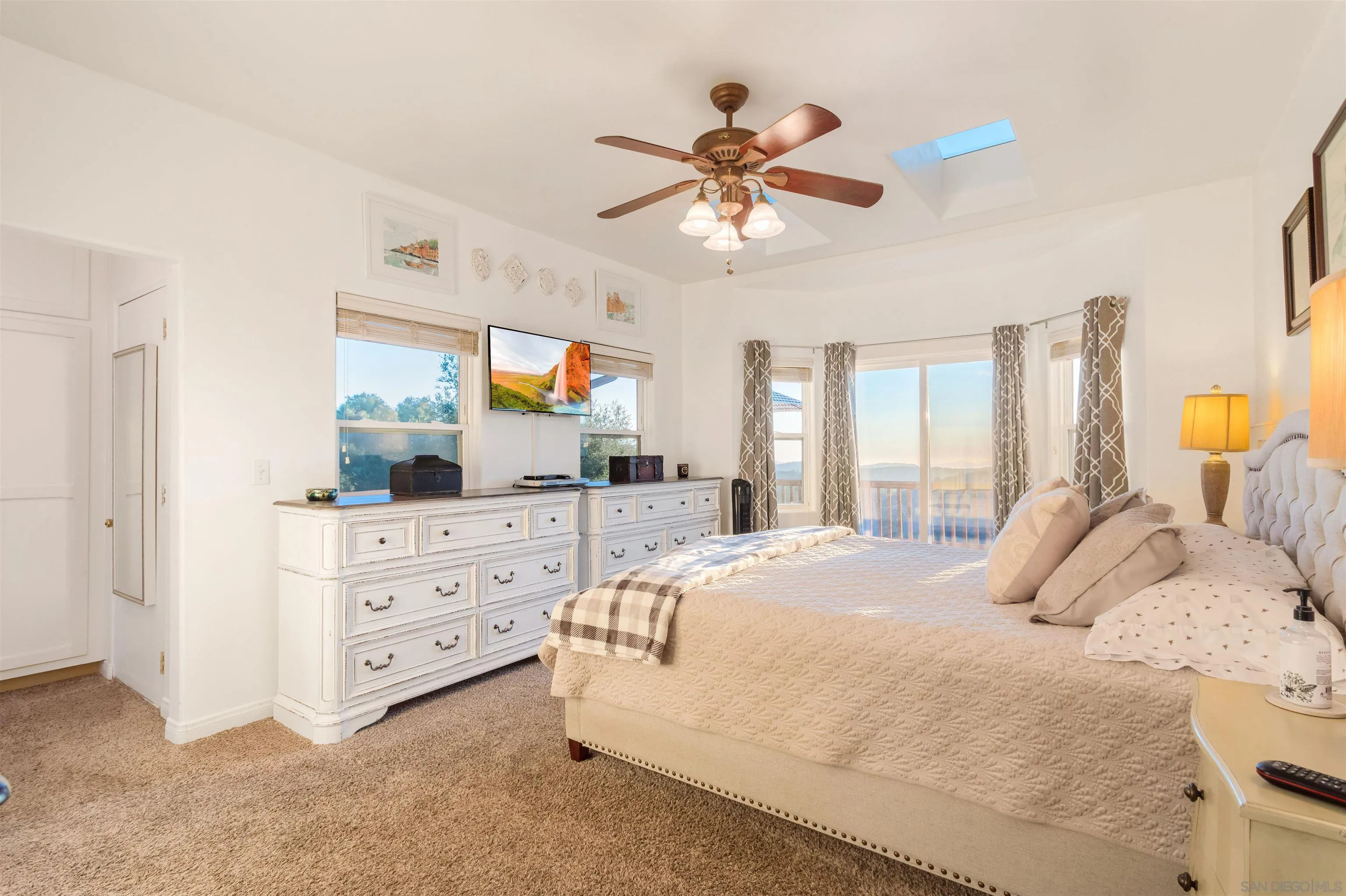 1210 Lakedale Road Santa Ysabel, CA 92070 - Photo 26 of 67 a bedroom with a bed chandelier and a window