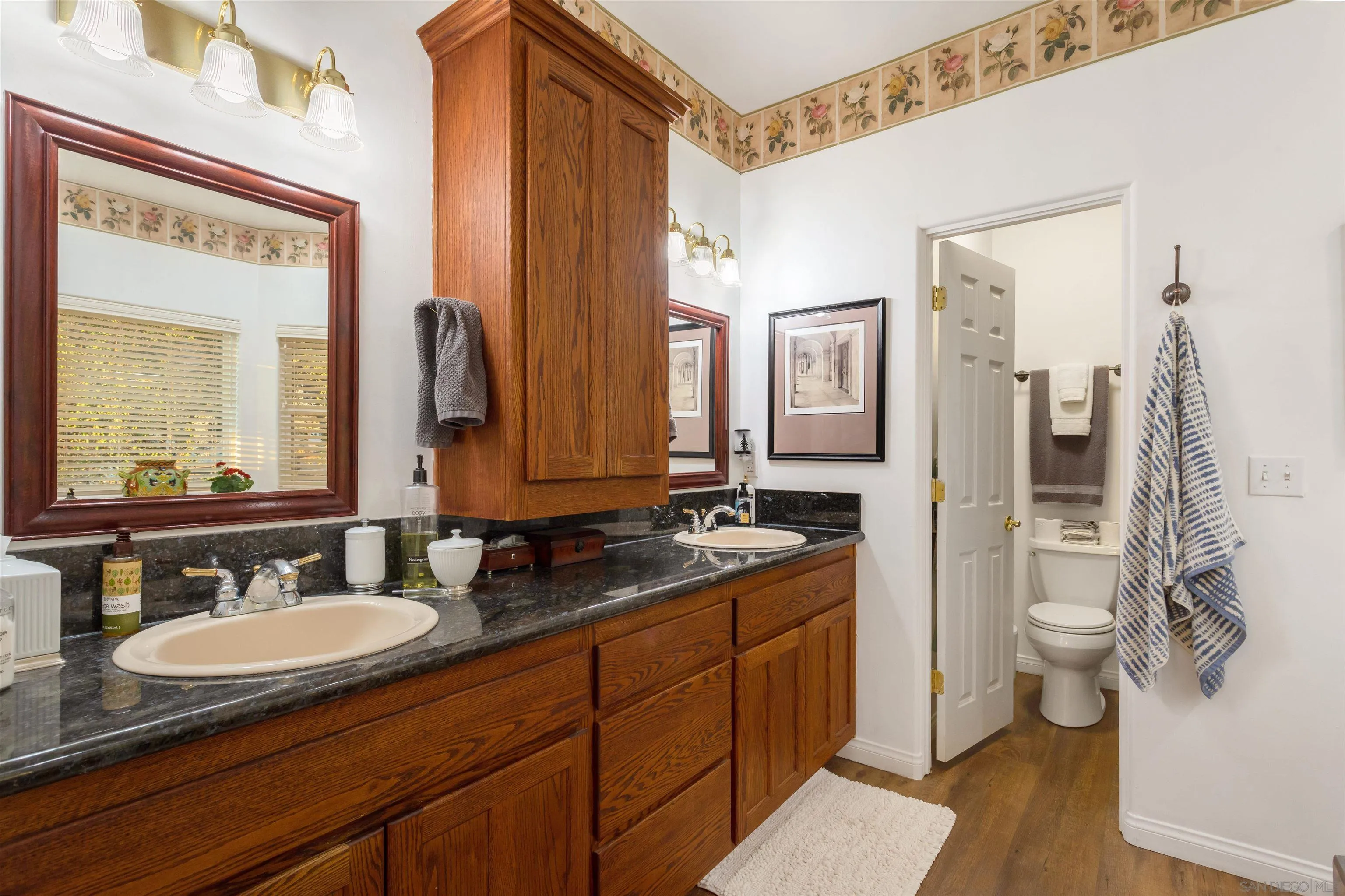 1210 Lakedale Road Santa Ysabel, CA 92070 - Photo 27 of 67 a bathroom with a granite countertop sink and a mirror