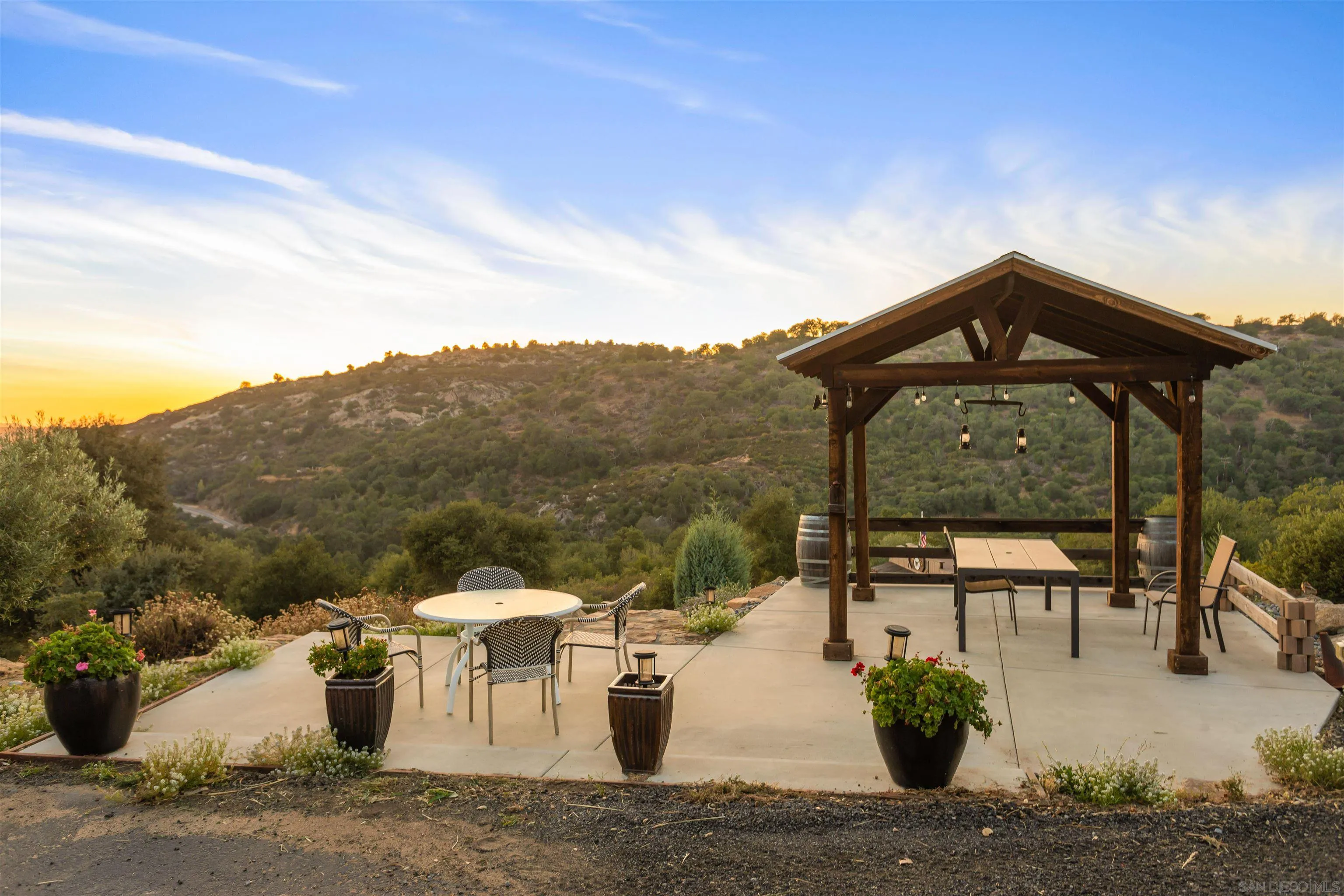 1210 Lakedale Road Santa Ysabel, CA 92070 - Photo 46 of 67 a view of a patio with couches table and chairs and potted plants