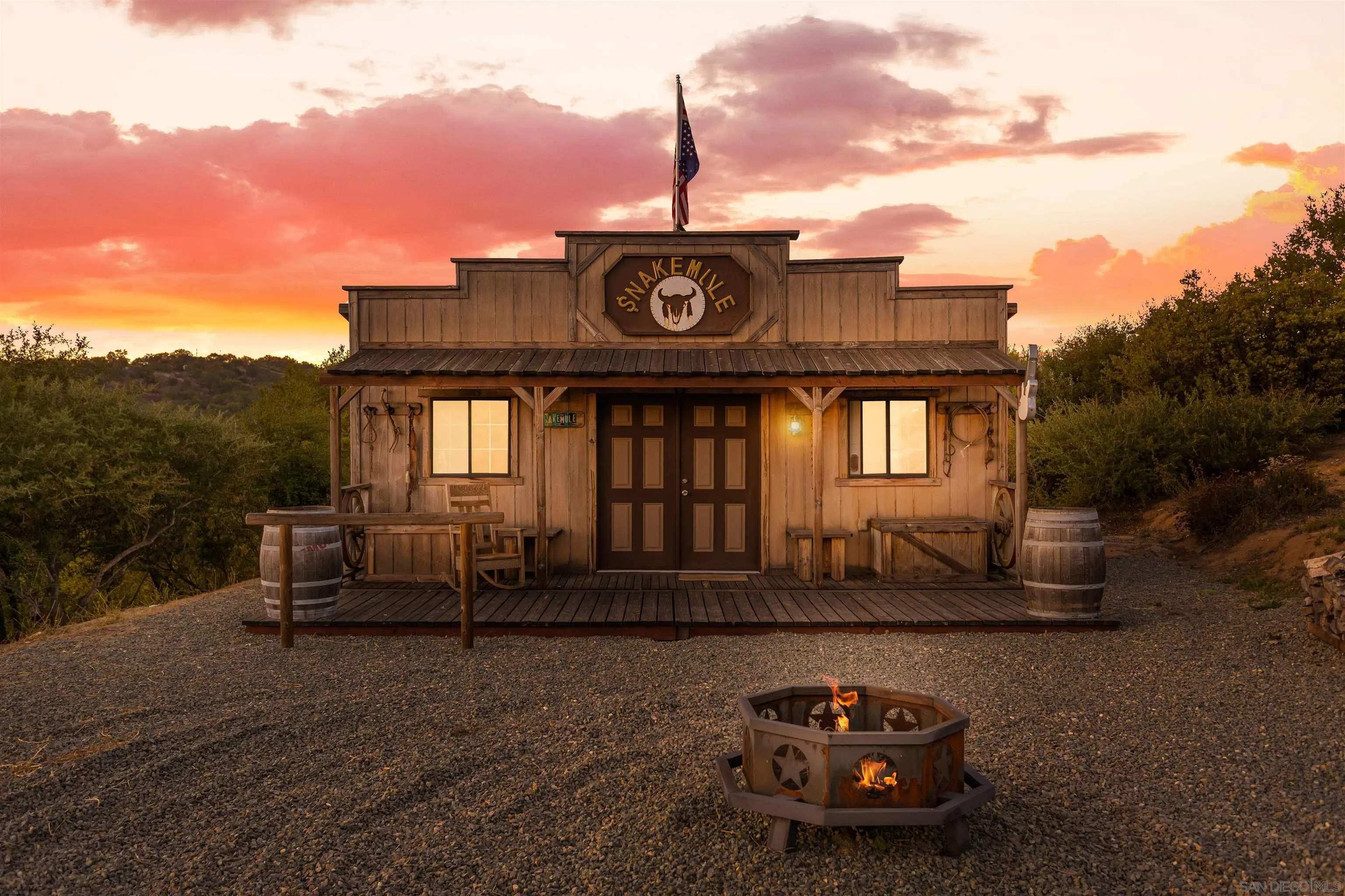 1210 Lakedale Road Santa Ysabel, CA 92070 - Photo 54 of 67 a table and chairs in front of a house