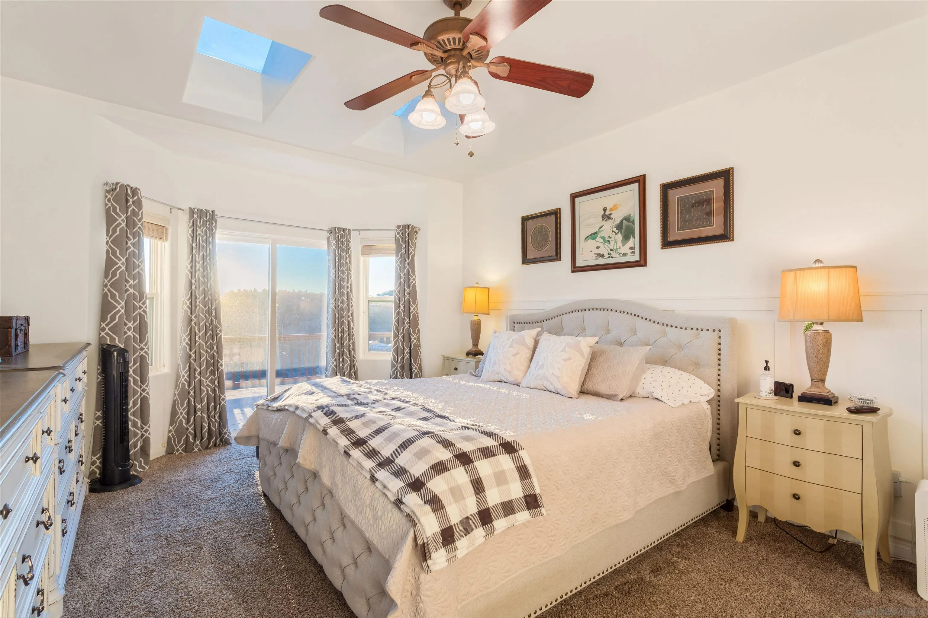 1210 Lakedale Road Santa Ysabel, CA 92070 - Photo 6 of 67 a bedroom with a bed and a chandelier