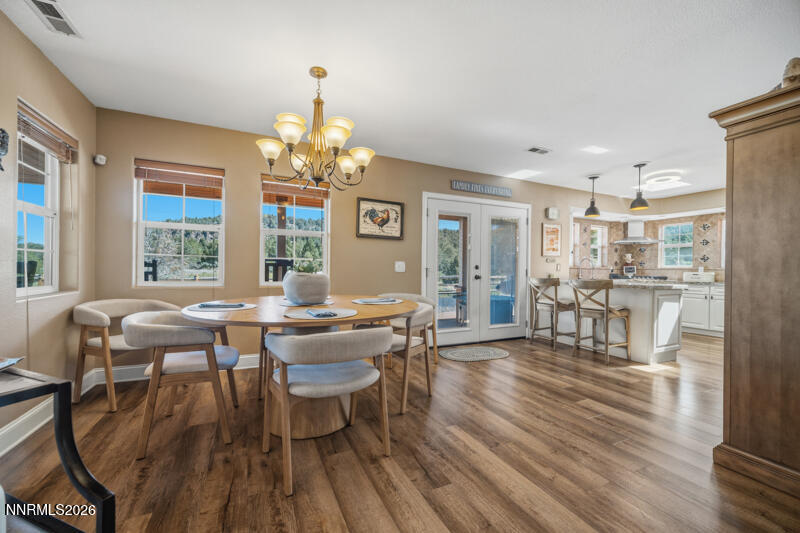 1931 Lousetown Road Reno, NV 89521 - Photo 6 of 51 a view of a dining room with furniture and wooden floor