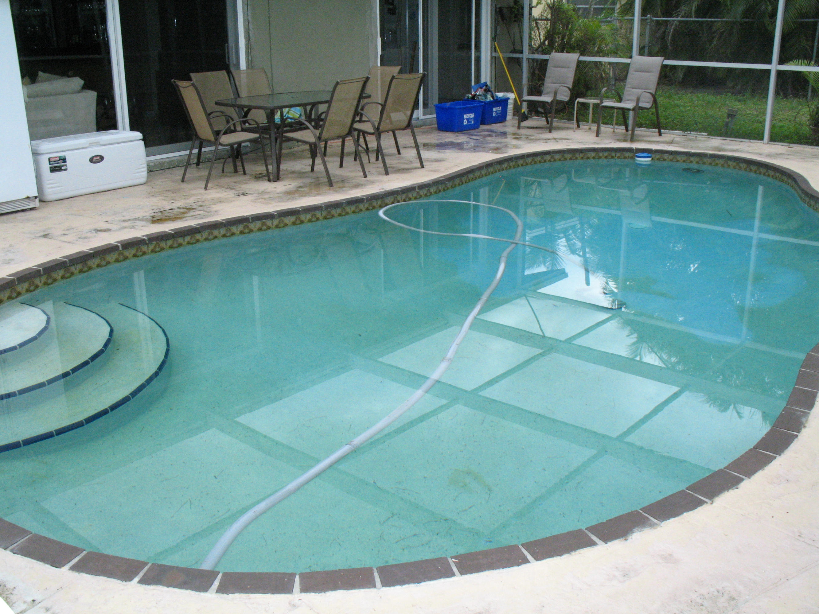 10213 Sleepy Brook Way Boca Raton, FL 33428 - Photo 3 of 15 a view of a swimming pool with a patio