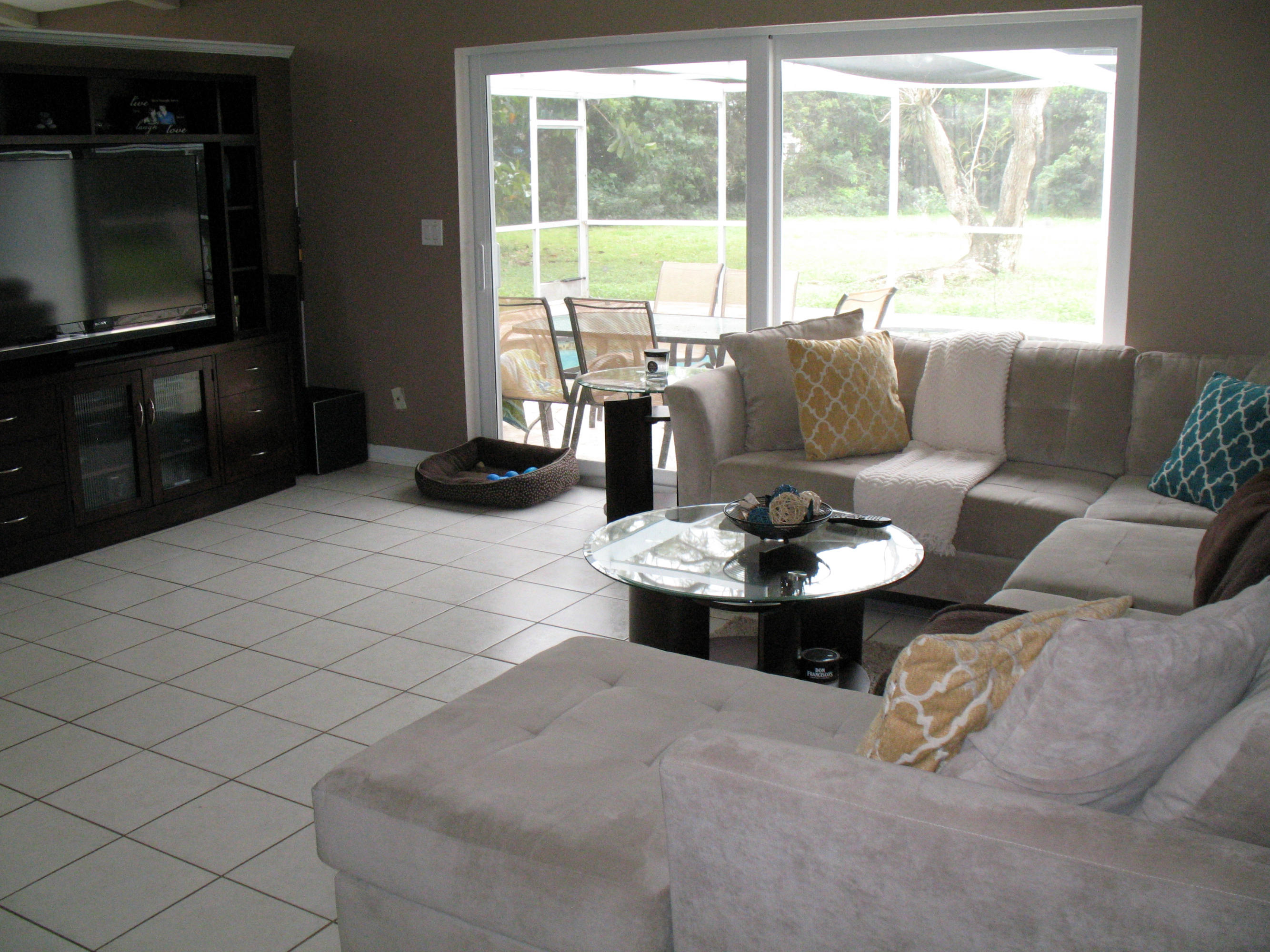 10213 Sleepy Brook Way Boca Raton, FL 33428 - Photo 8 of 15 a living room with furniture and a flat screen tv