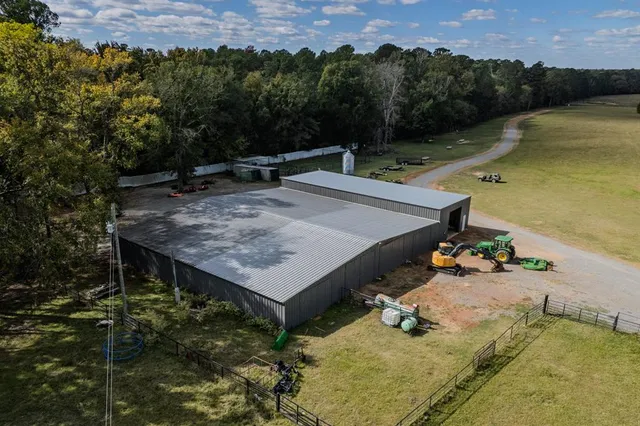 a view of a patio with table and chairs and a fire pit