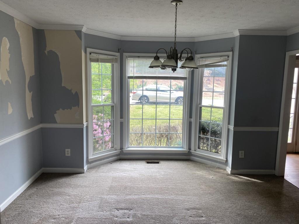 4749 Shallow Ridge Road Northeast Kennesaw, GA 30144 - Photo 11 of 28 a view of an empty room with a window
