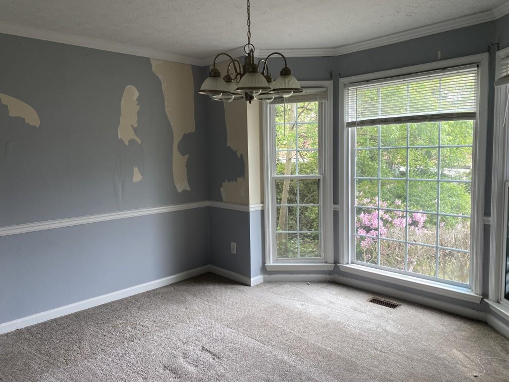4749 Shallow Ridge Road Northeast Kennesaw, GA 30144 - Photo 12 of 28 a view of room with window and chandelier