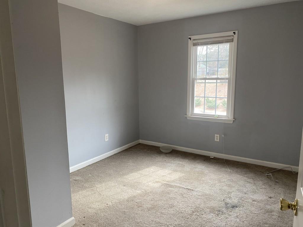 4749 Shallow Ridge Road Northeast Kennesaw, GA 30144 - Photo 15 of 28 an empty room with a window