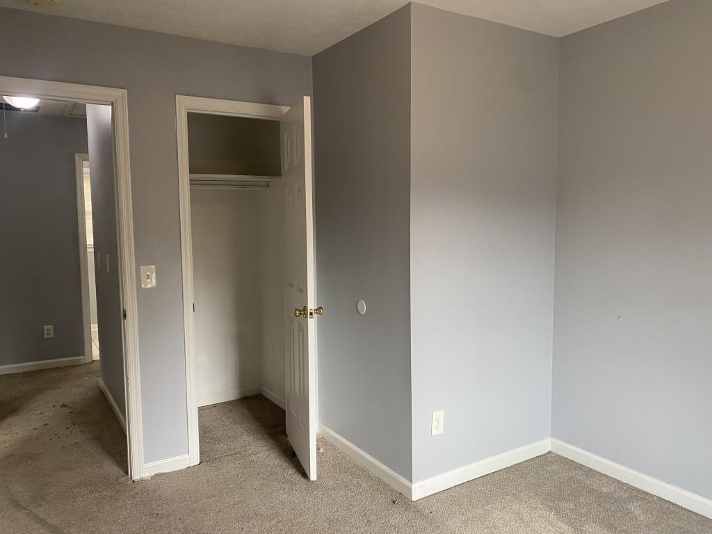 4749 Shallow Ridge Road Northeast Kennesaw, GA 30144 - Photo 16 of 28 an empty room with closet