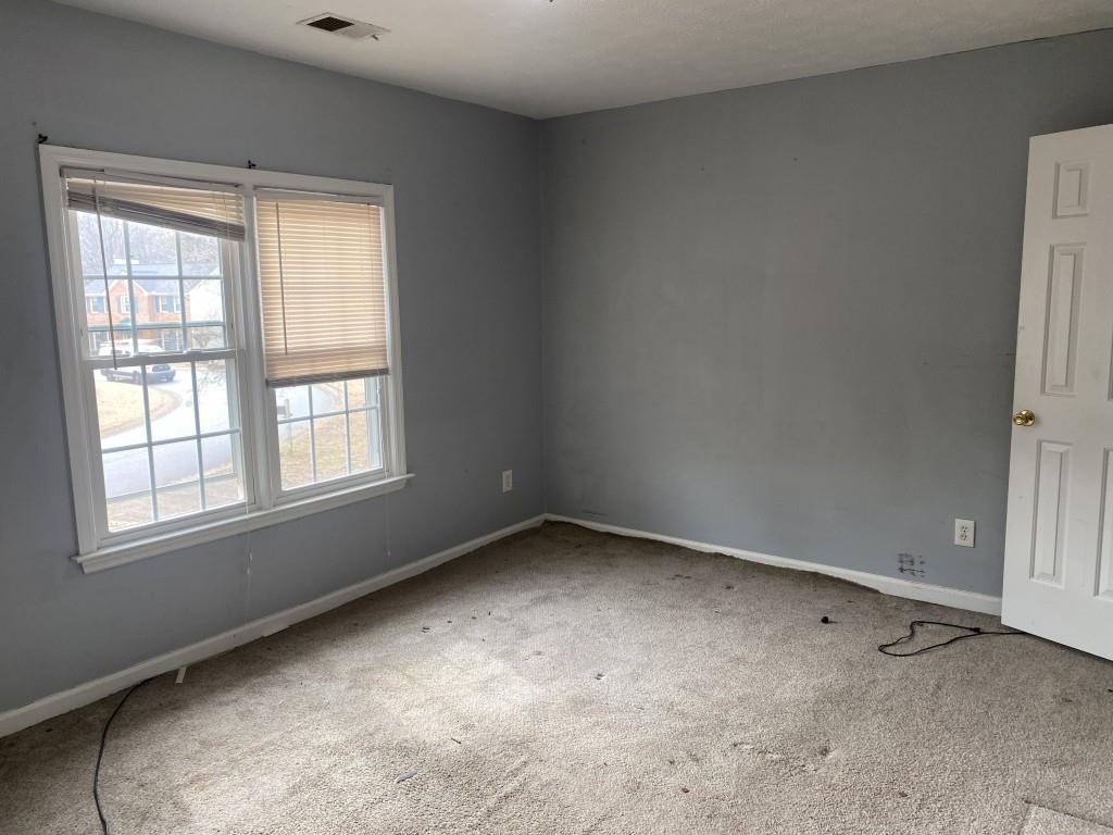 4749 Shallow Ridge Road Northeast Kennesaw, GA 30144 - Photo 19 of 28 an empty room with a window