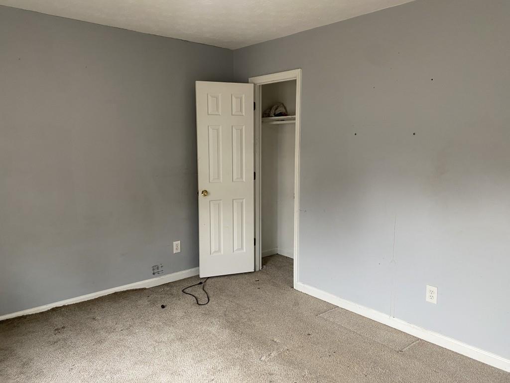 4749 Shallow Ridge Road Northeast Kennesaw, GA 30144 - Photo 20 of 28 an empty room with closet area