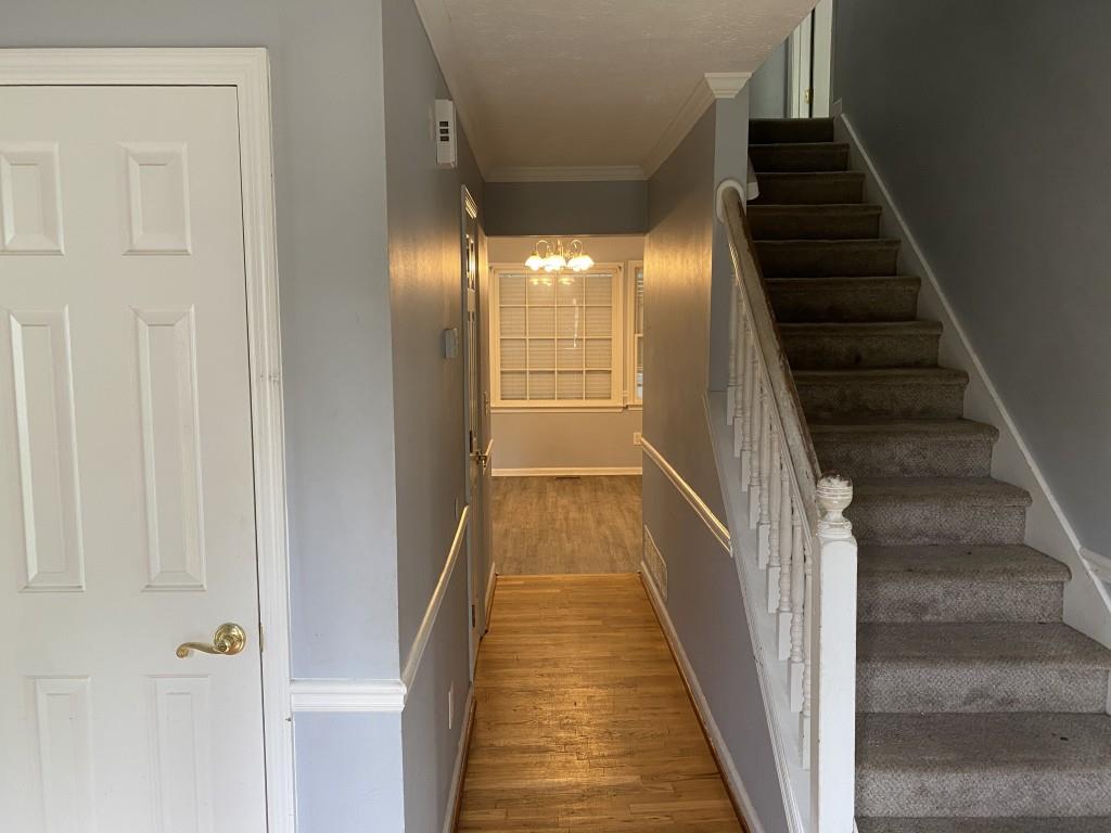 4749 Shallow Ridge Road Northeast Kennesaw, GA 30144 - Photo 2 of 28 a view of a hallway with wooden floor and entryway